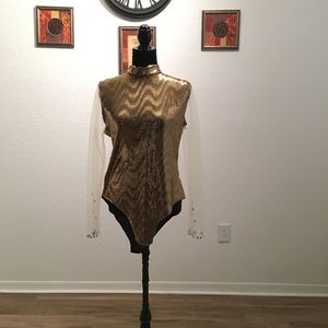 “Gold body suit”